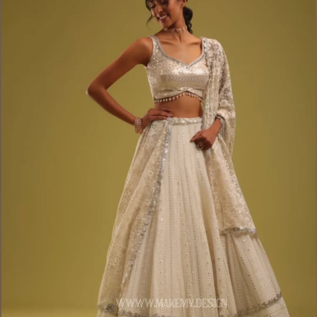 ivory white lehenga set with a intricate lucknowi embroidery style 100% customer satisfactioncu.webp