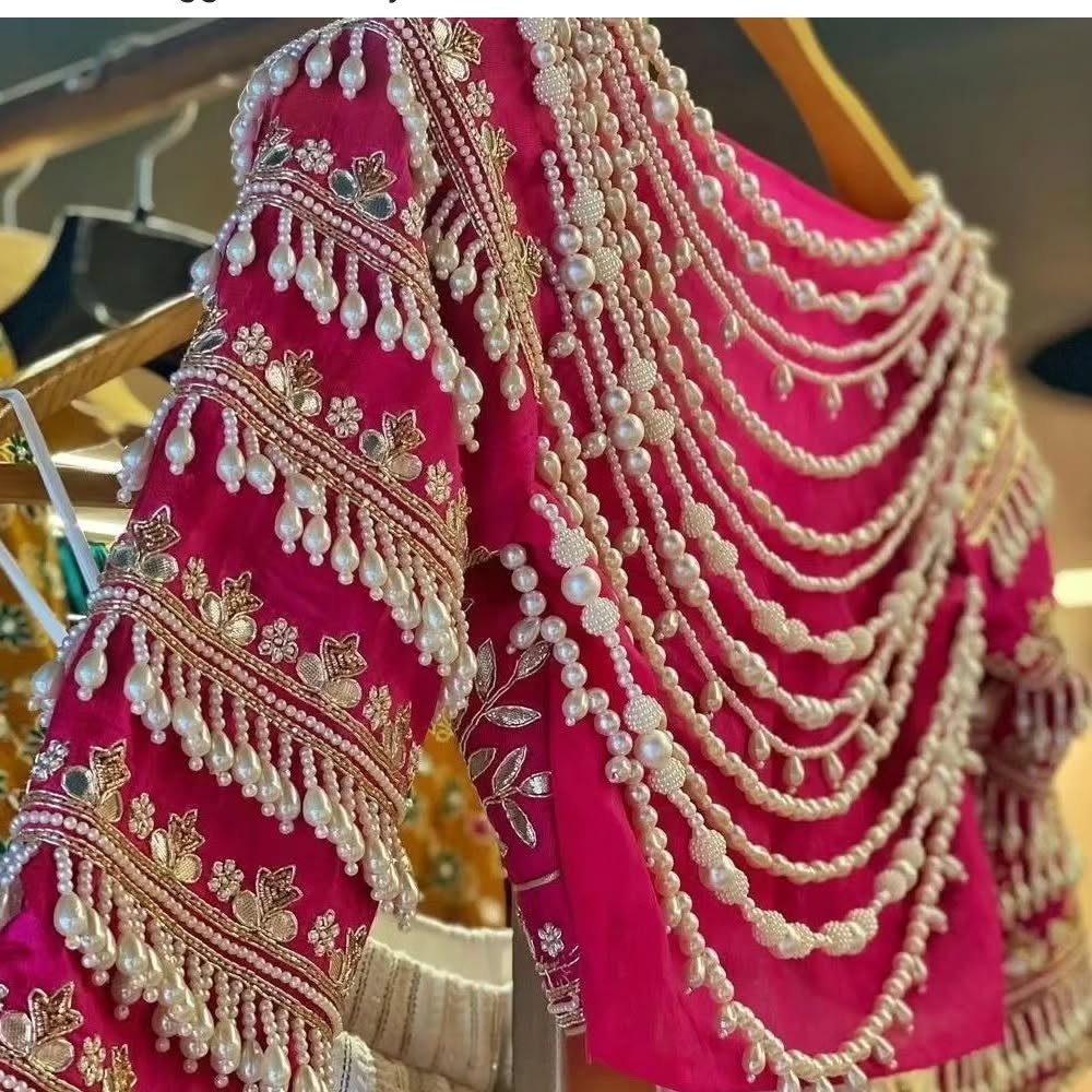 Pink bridal blouse with layered pearl tassel work